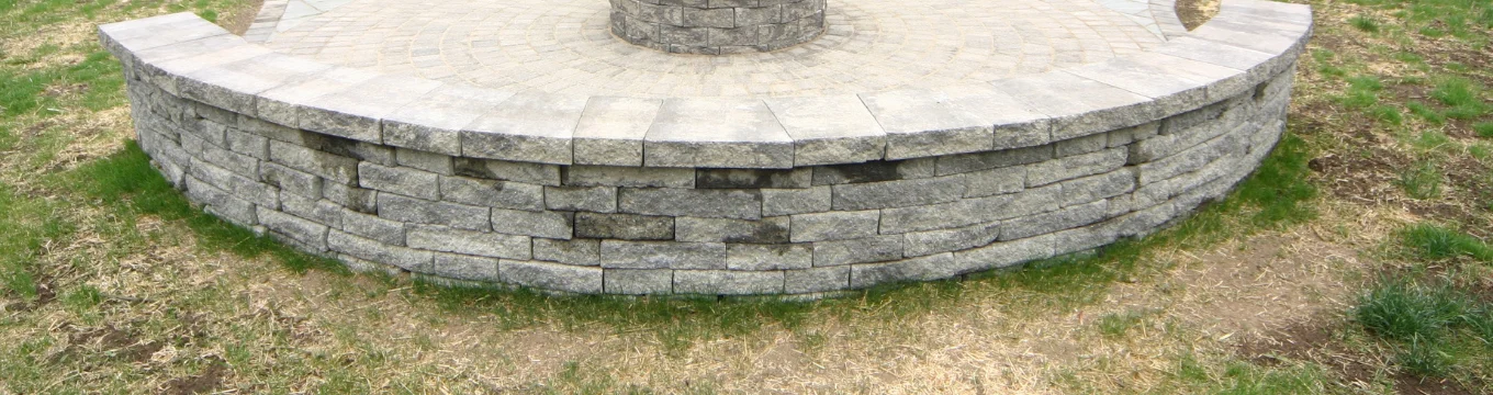 Curved stone seating wall on a Connecticut patio