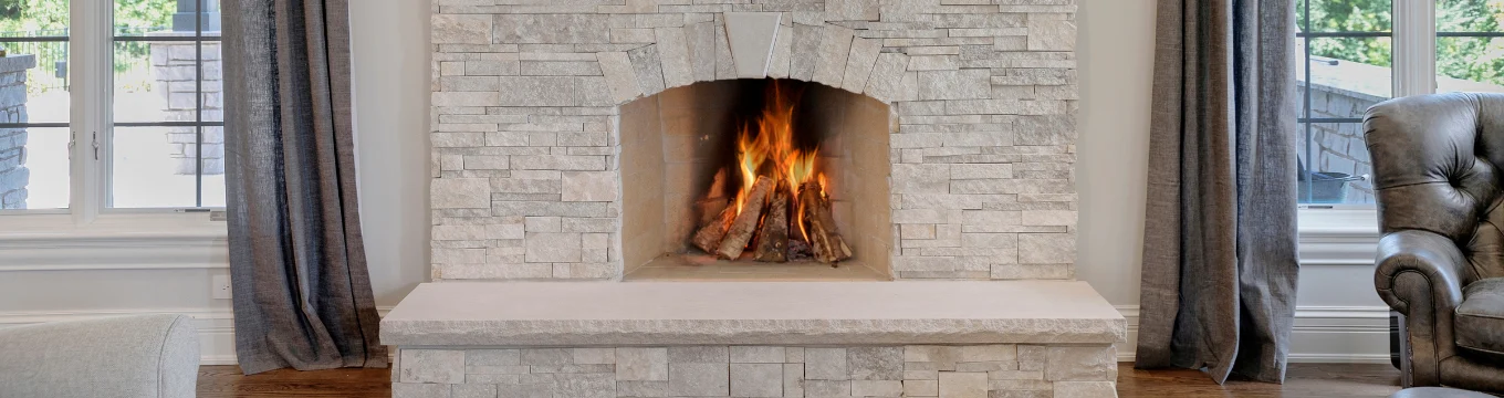White stone indoor fireplace